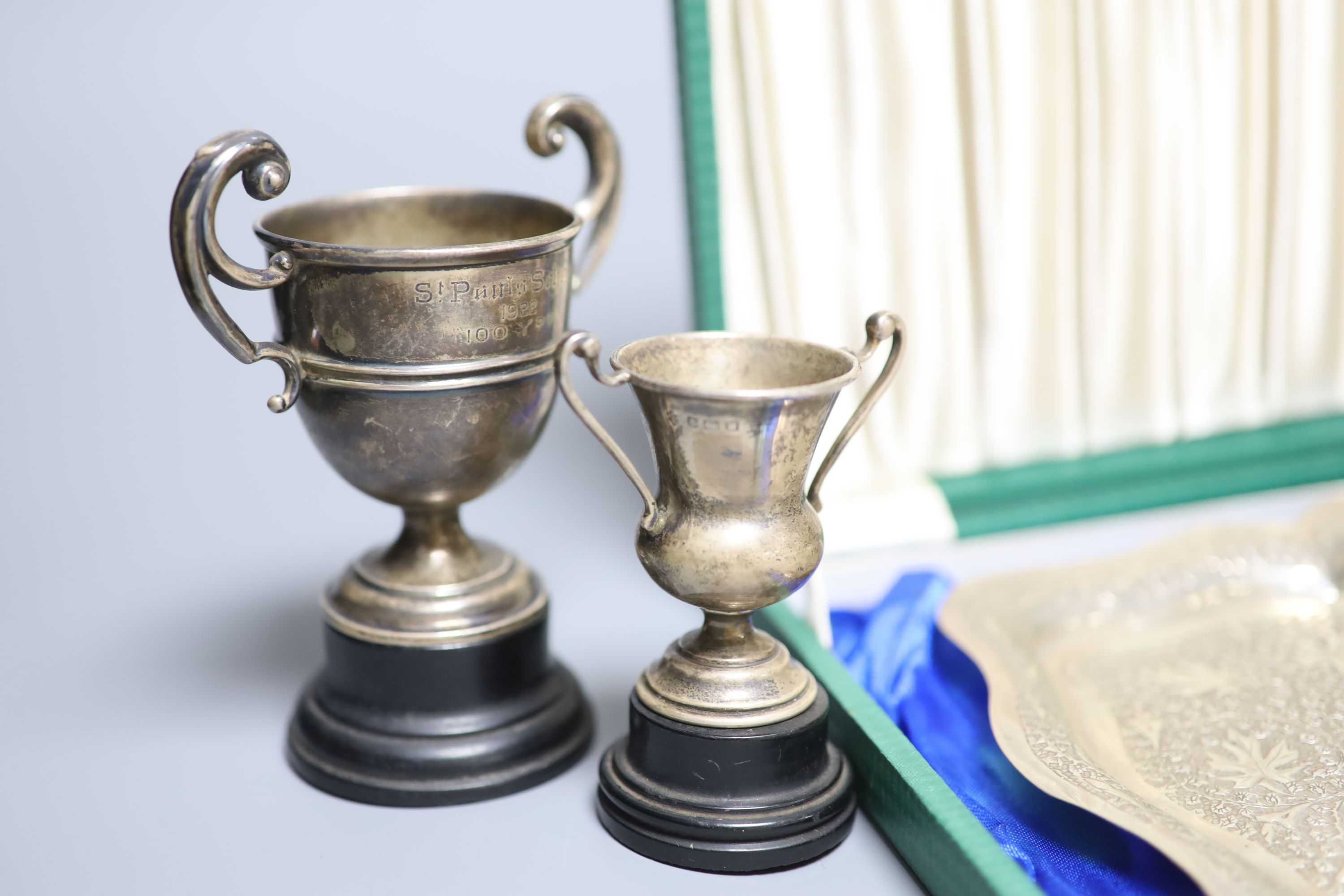 A Victorian engraved silver trophy cup, 'Twelve Hours Road Race', 1895, two small silver trophy cups and an embossed white metal presentation tray